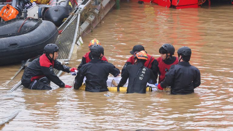 Search and rescue operation at an underpass that has been submerged by a flooded river caused by torrential rain in Cheongju
