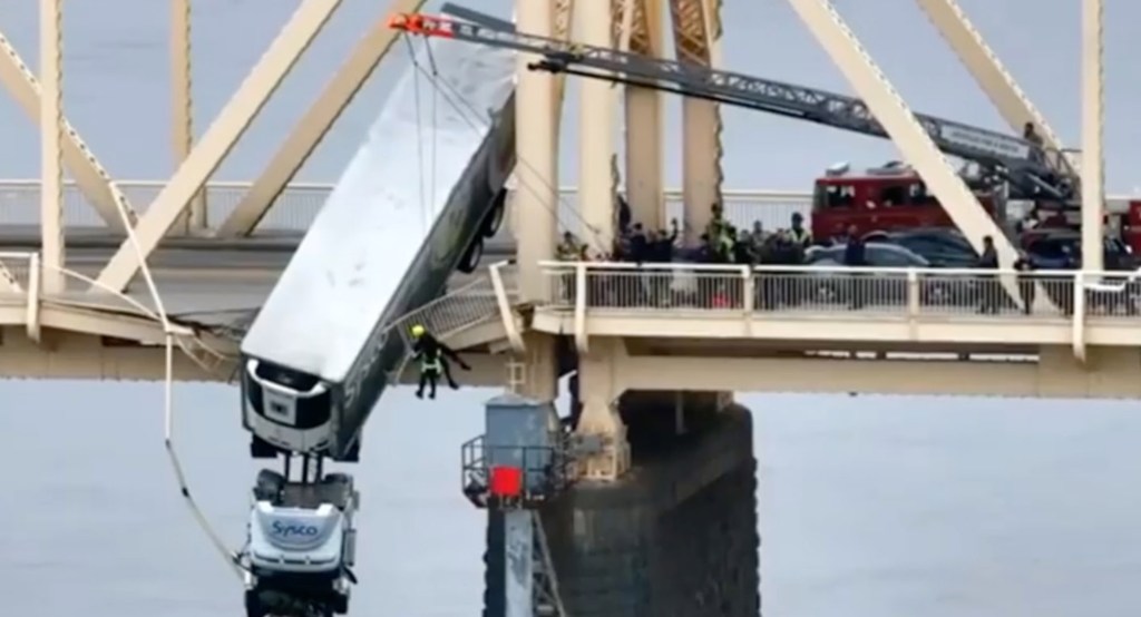 Driver pulled from truck dangling from Louisville bridge over Ohio River